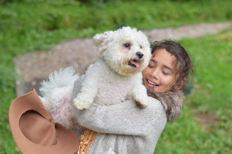sylvia cuddling Yoda the dog