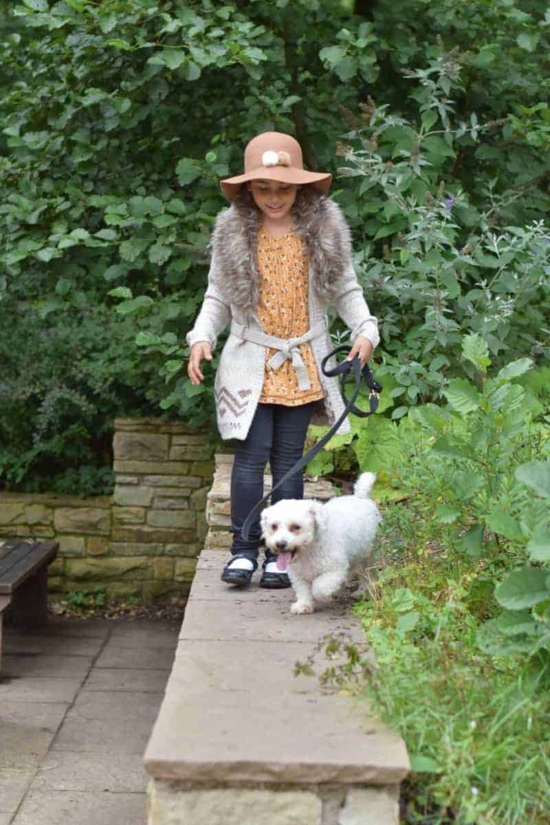GIRL AND BICHON DOG