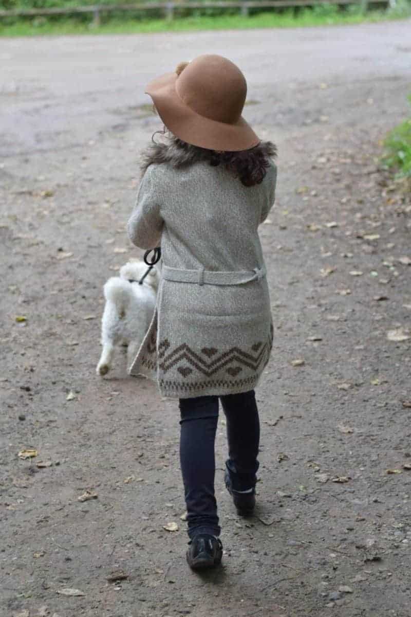 girl and bichon dog