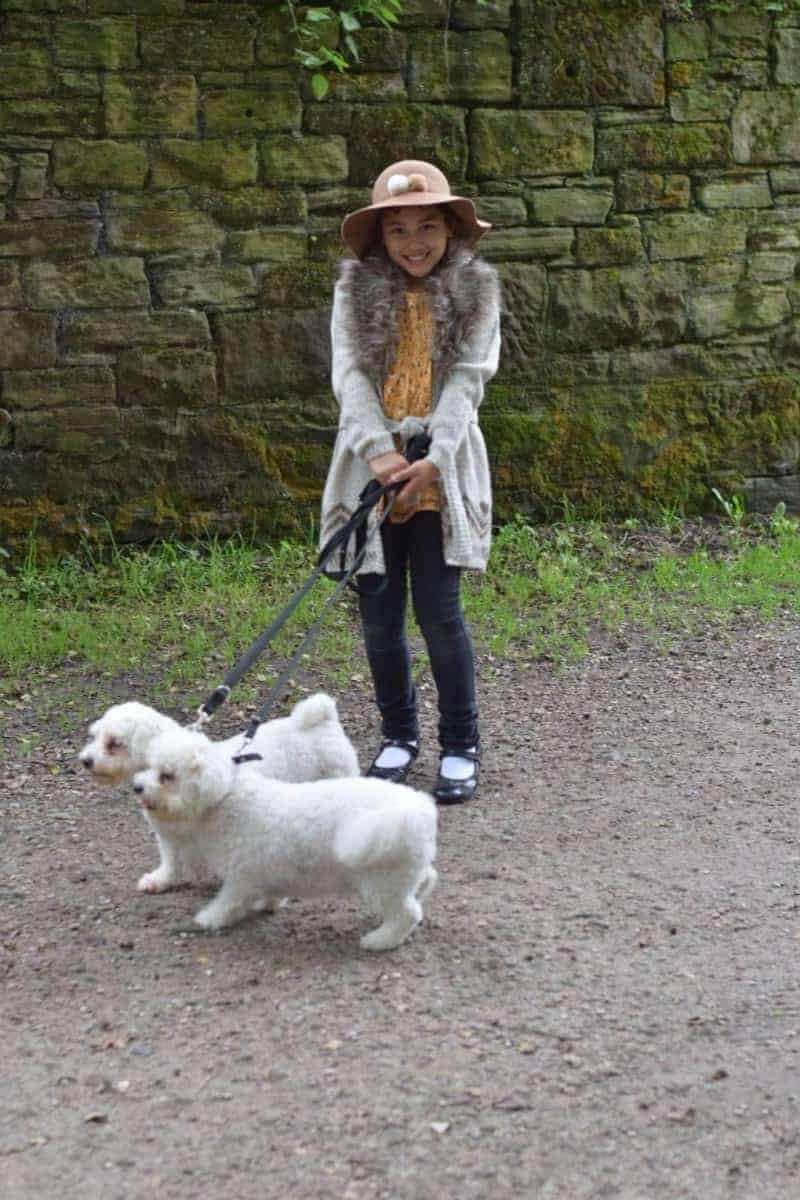 girl and bichon dog