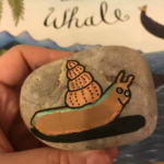 Snail painting on a rock.