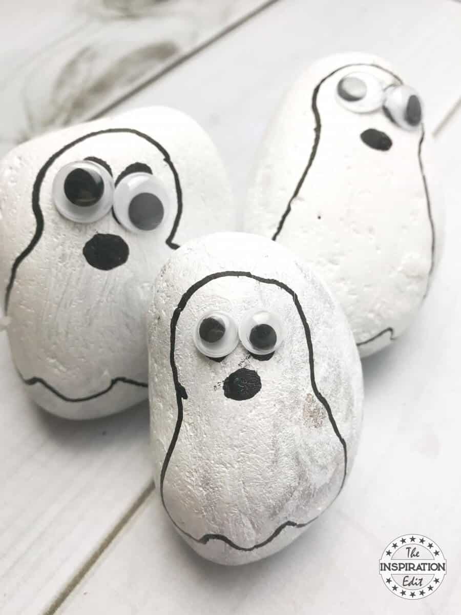 Halloween ghost painted rocks.
