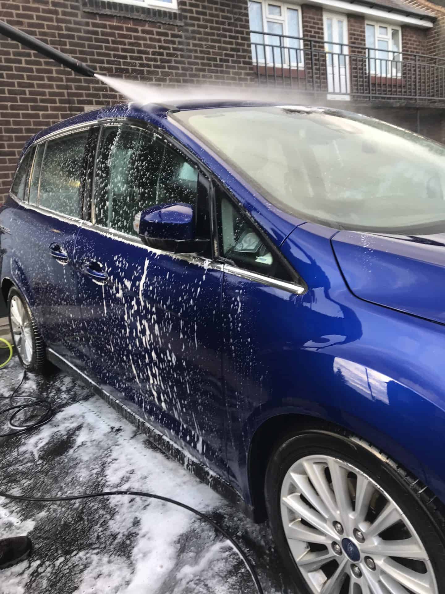 washing the car with a STILH RE 98 pressure washer