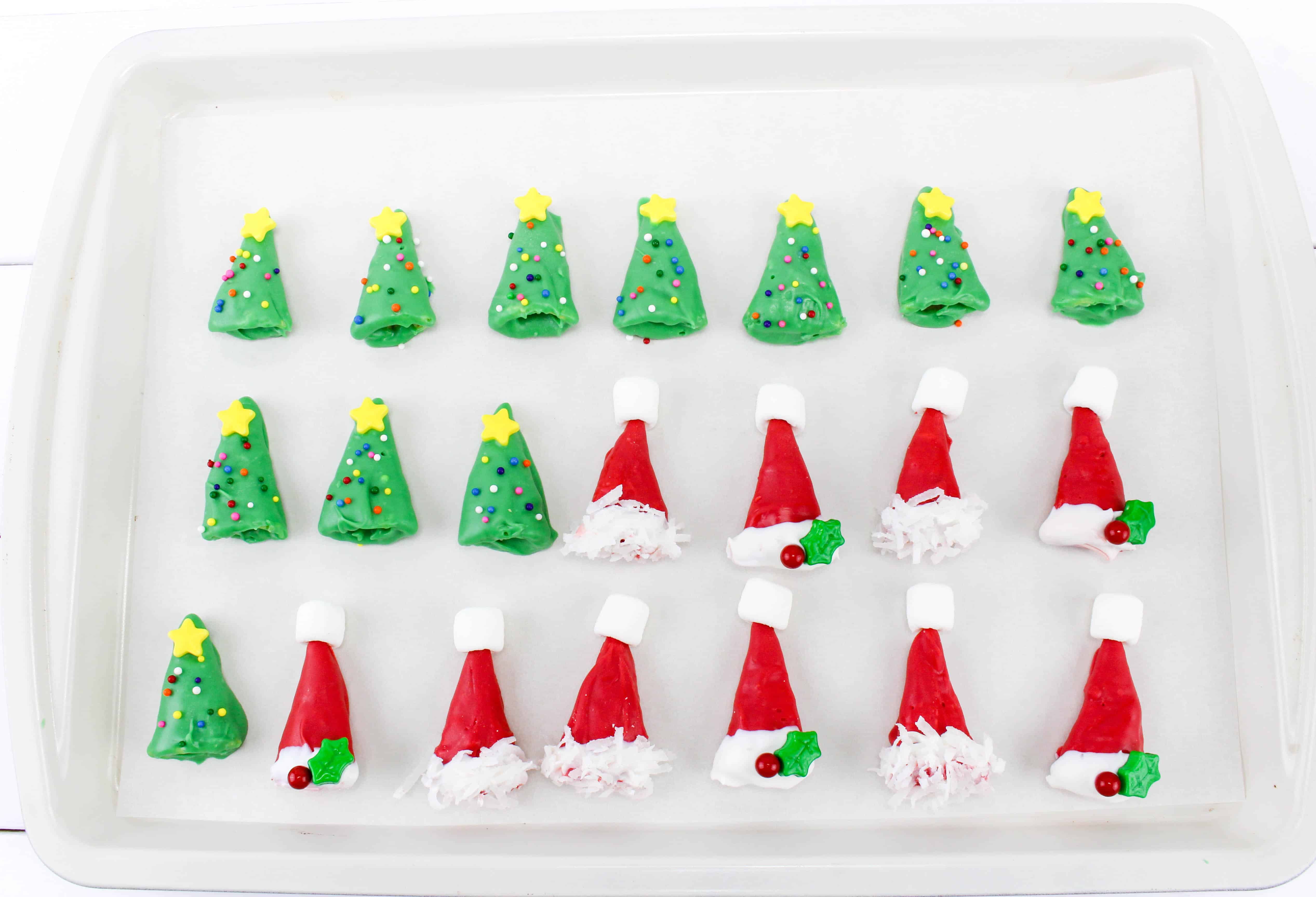 Making Christmas trees and santa caps with chocolate.