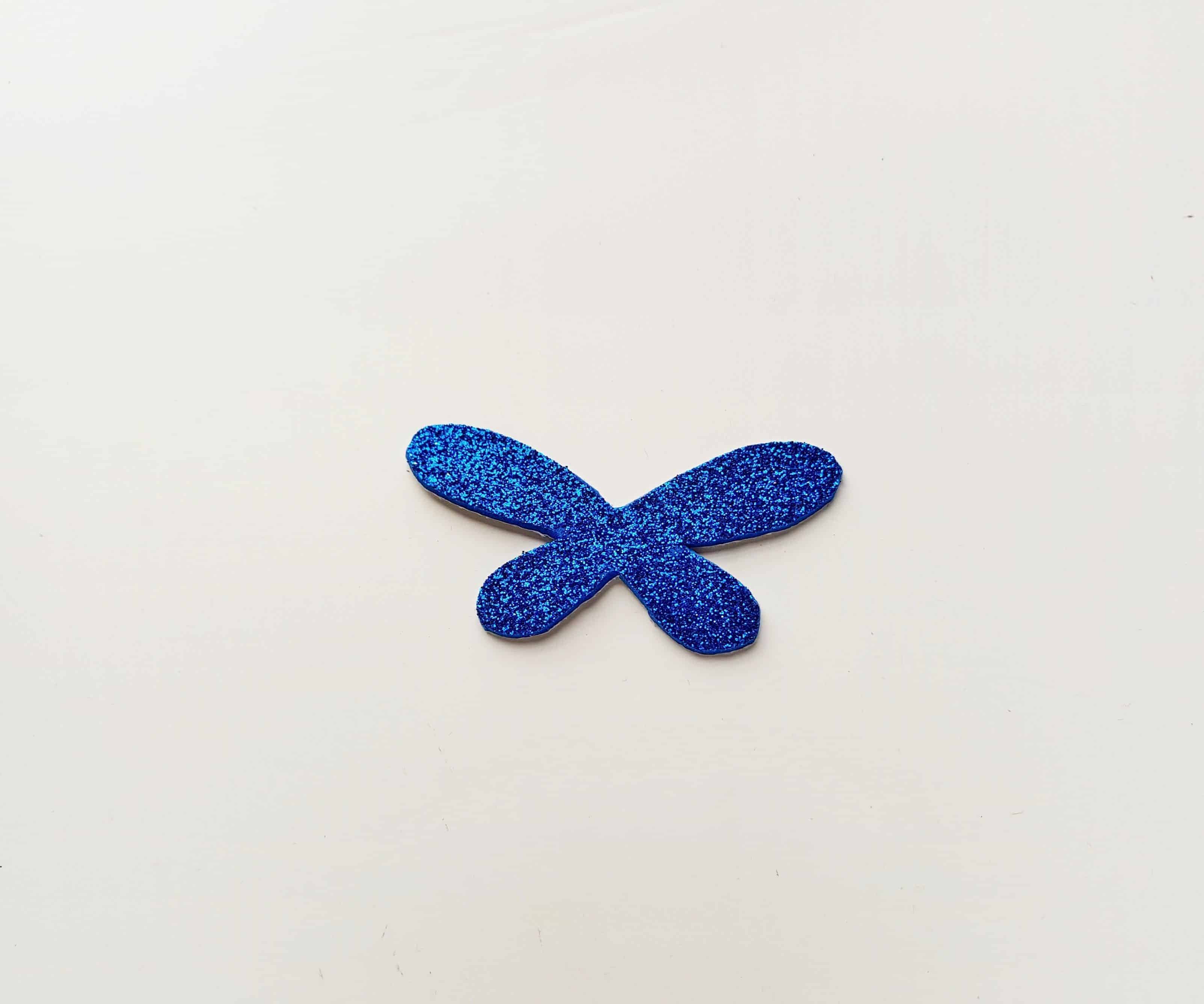 Dragonfly Craft Adding the Dragonfly Wings to the Popsicle Stick.
