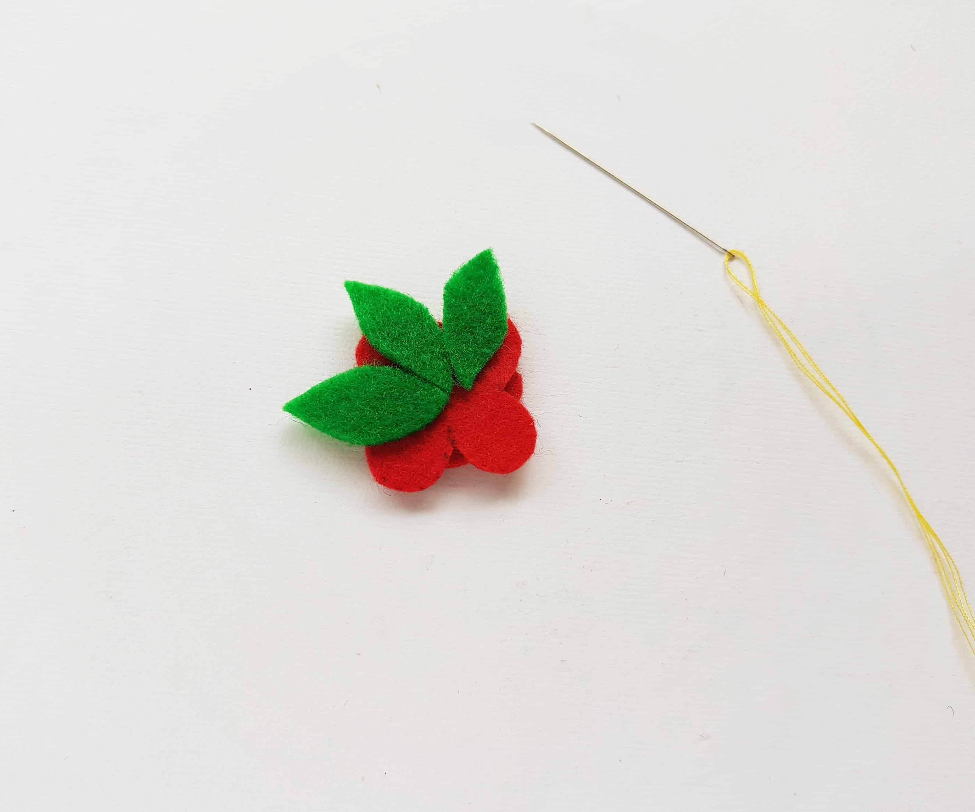 Sewing Leaves onto a Poppy.
