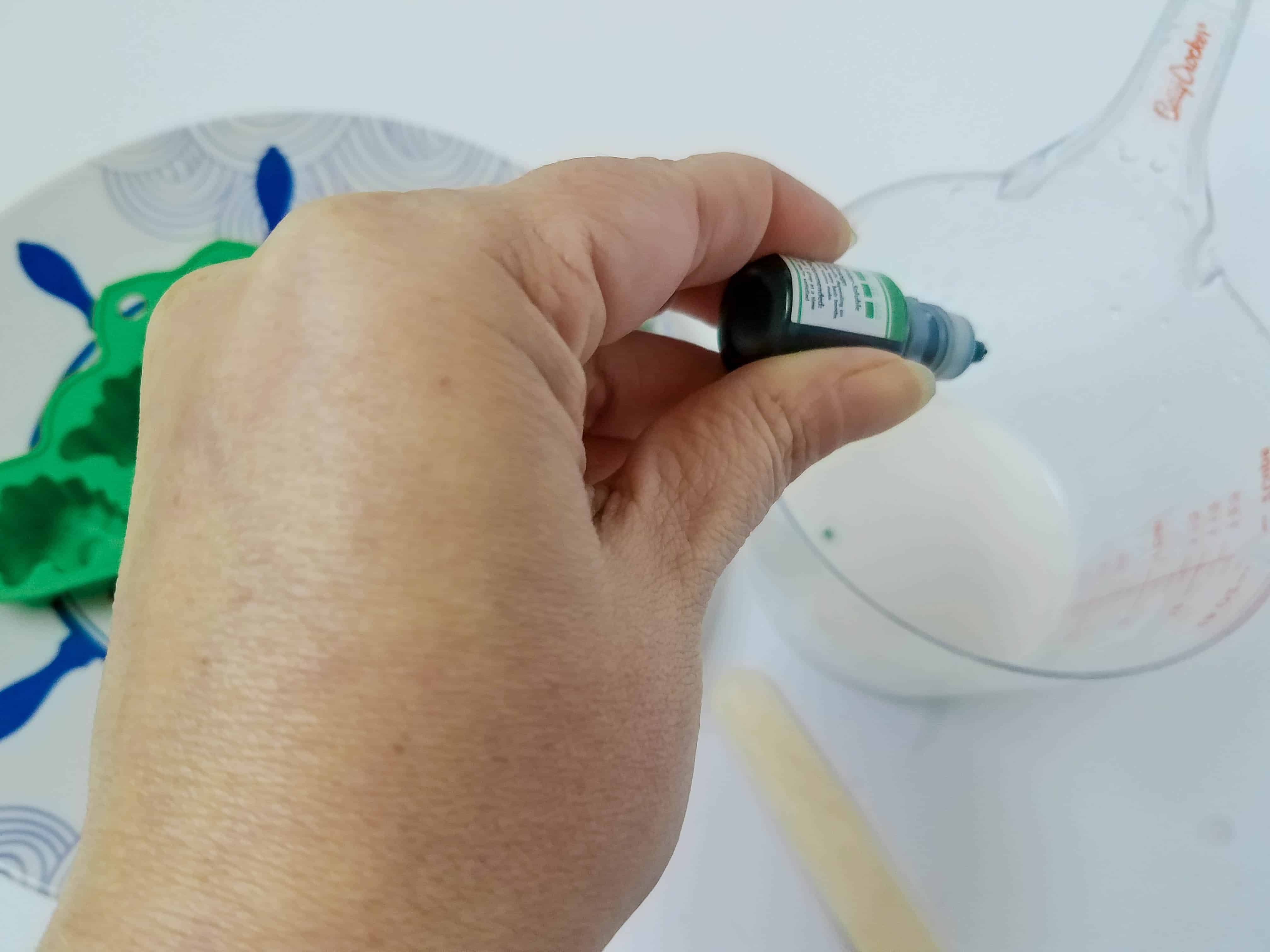 Pouring Liquid Soap into Dinosaur Mold.