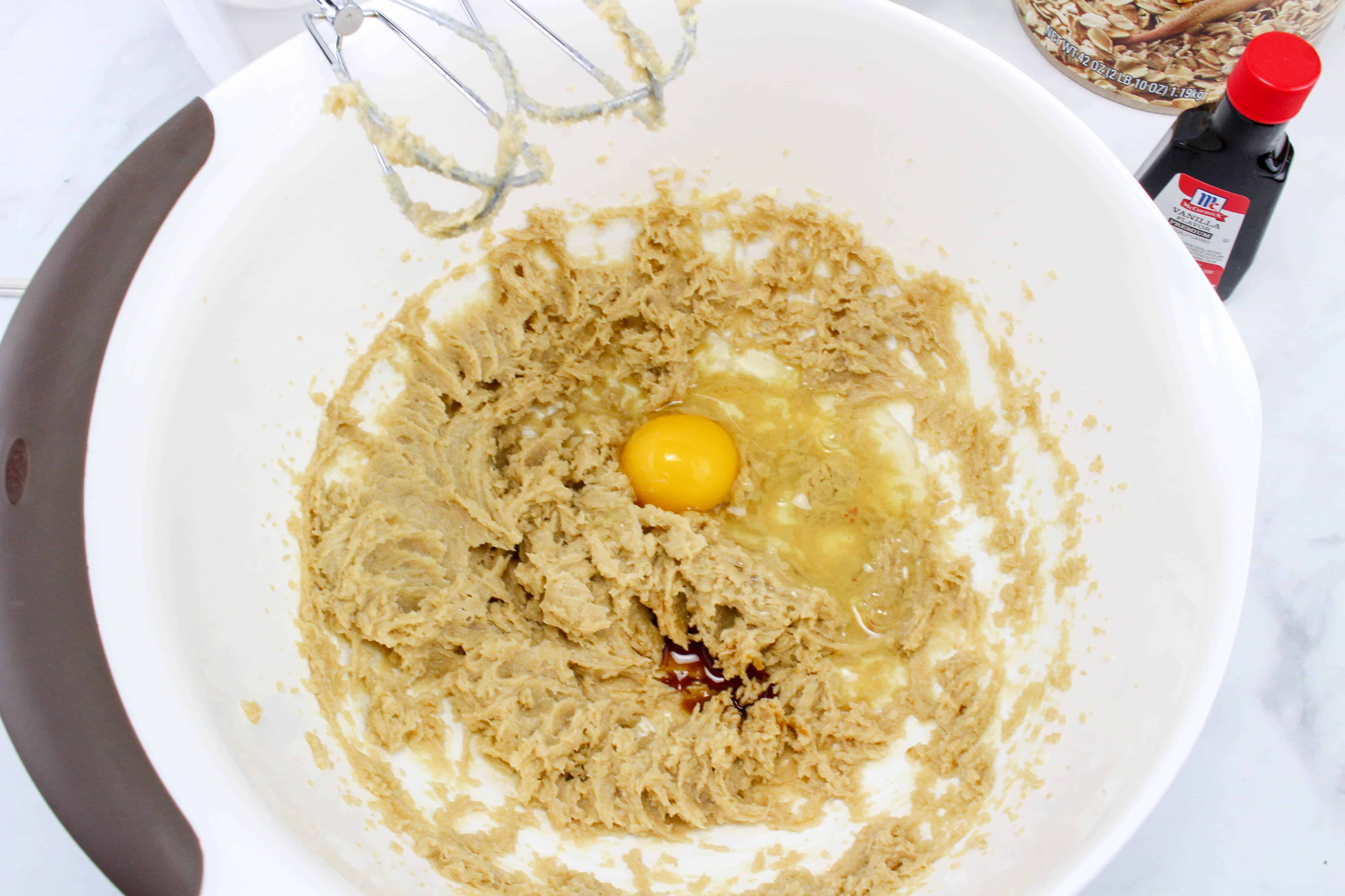 Mixing butter, brown sugar, honey, vanilla, and egg in a bowl.