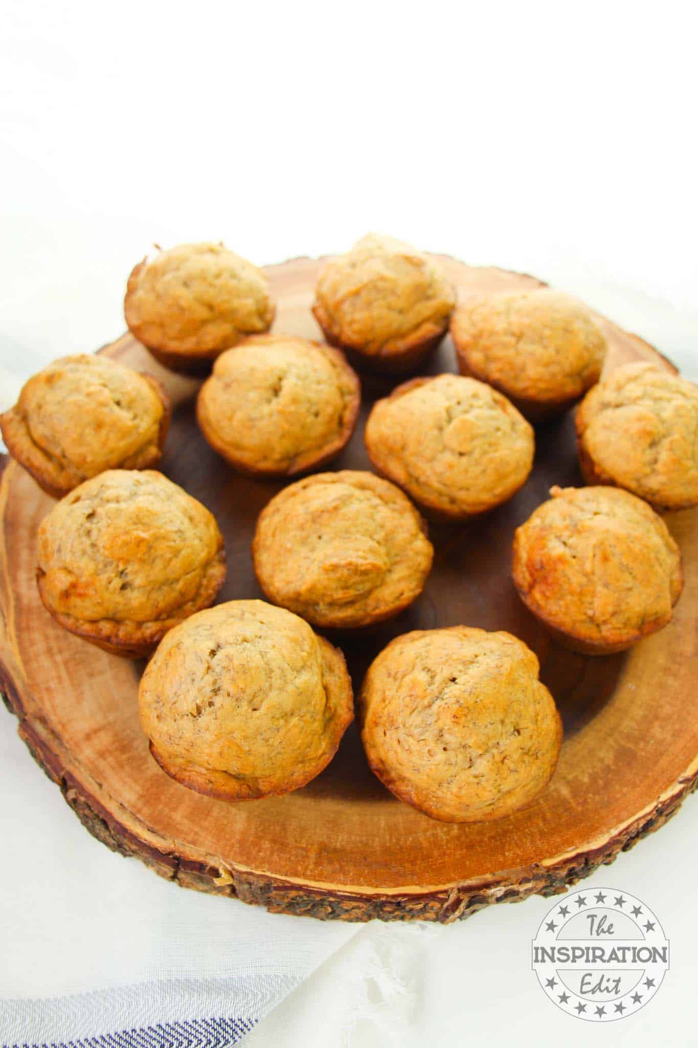 Banana muffins on wooden board.