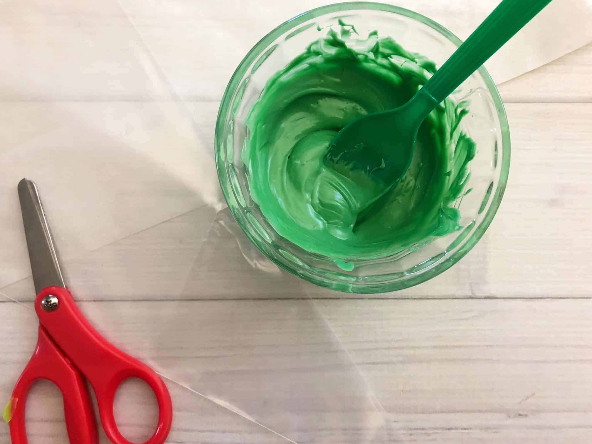 Green melted candies in a bowl.