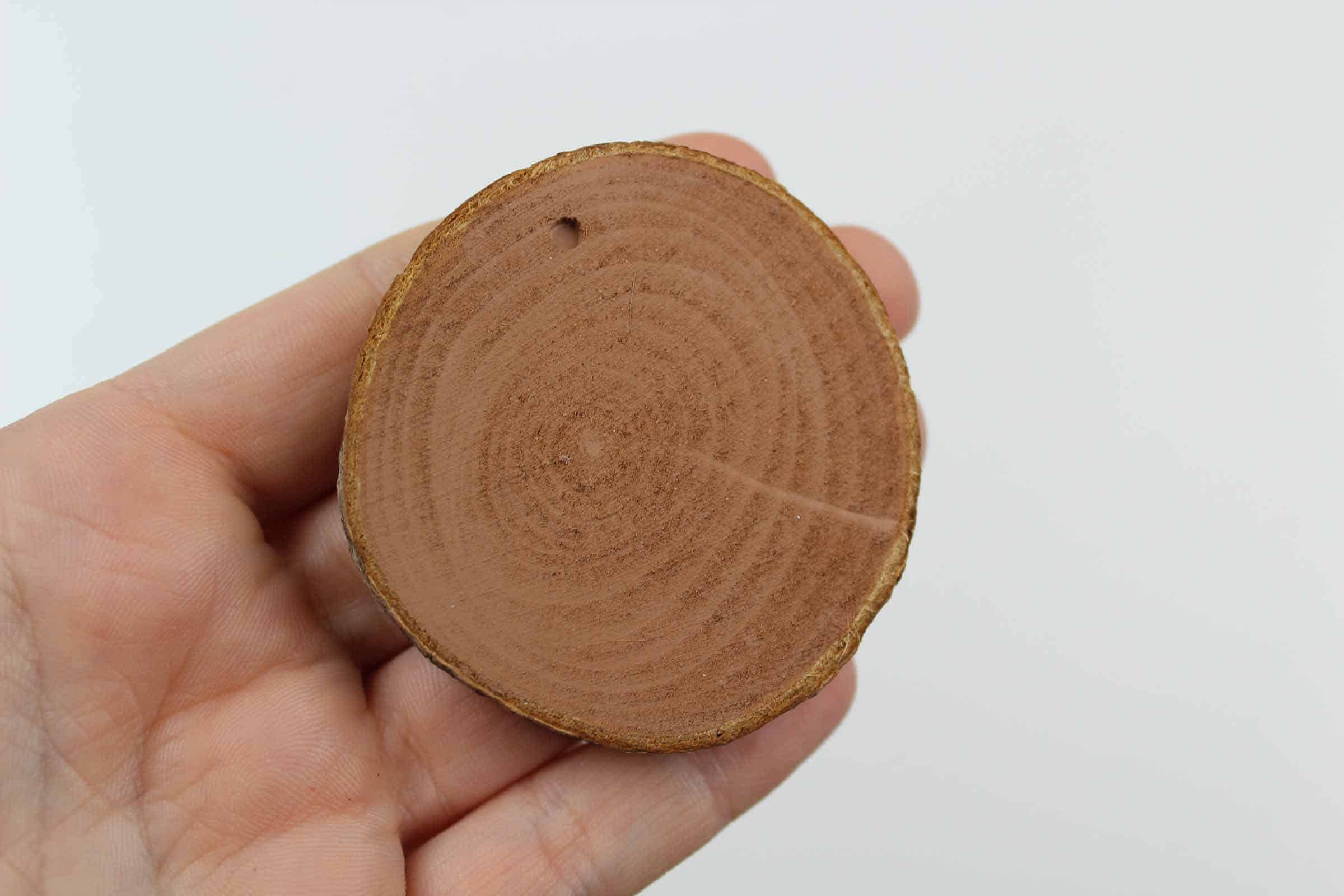 Round piece of wood.