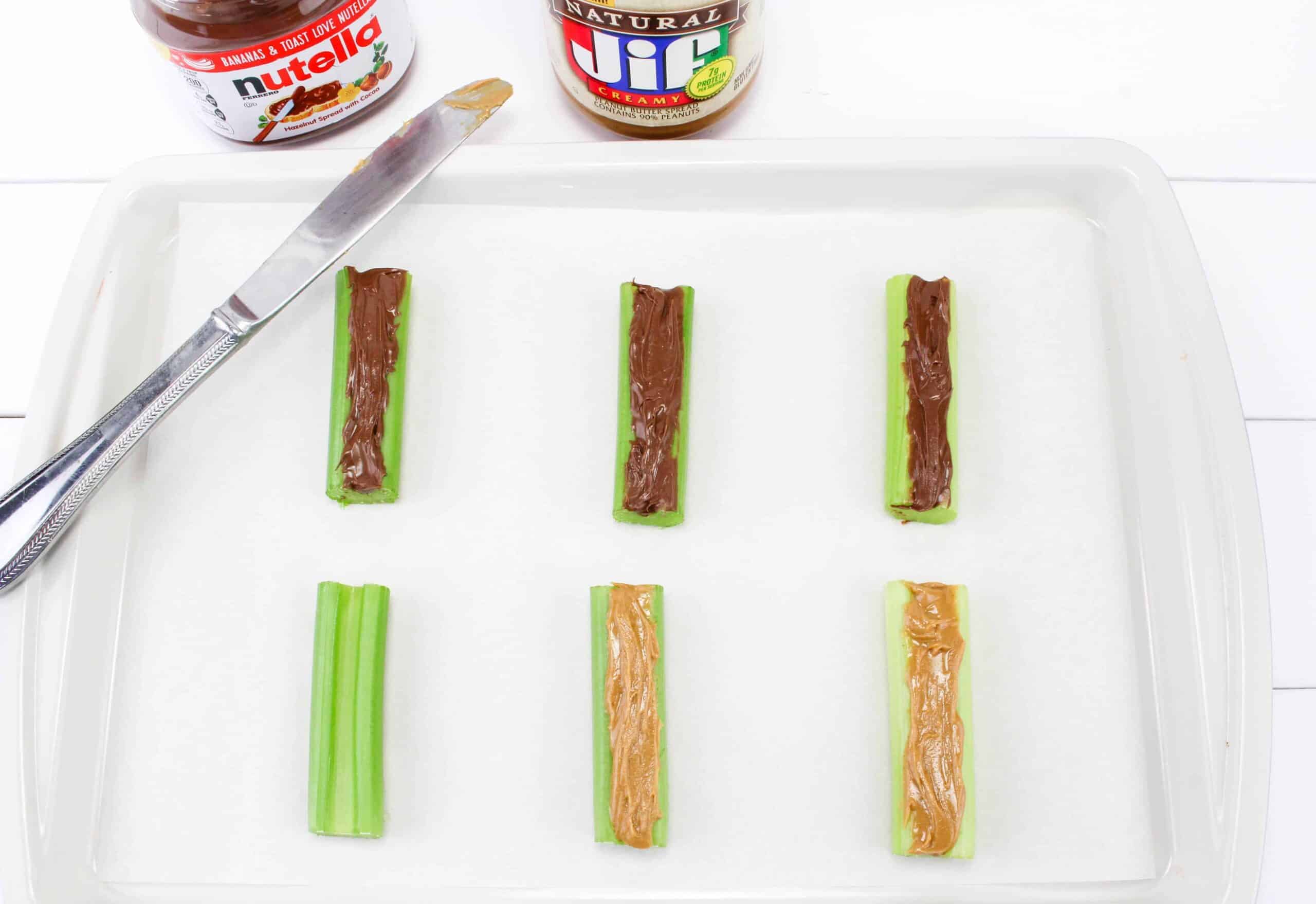 Nutella and peanut butter on celery sticks.