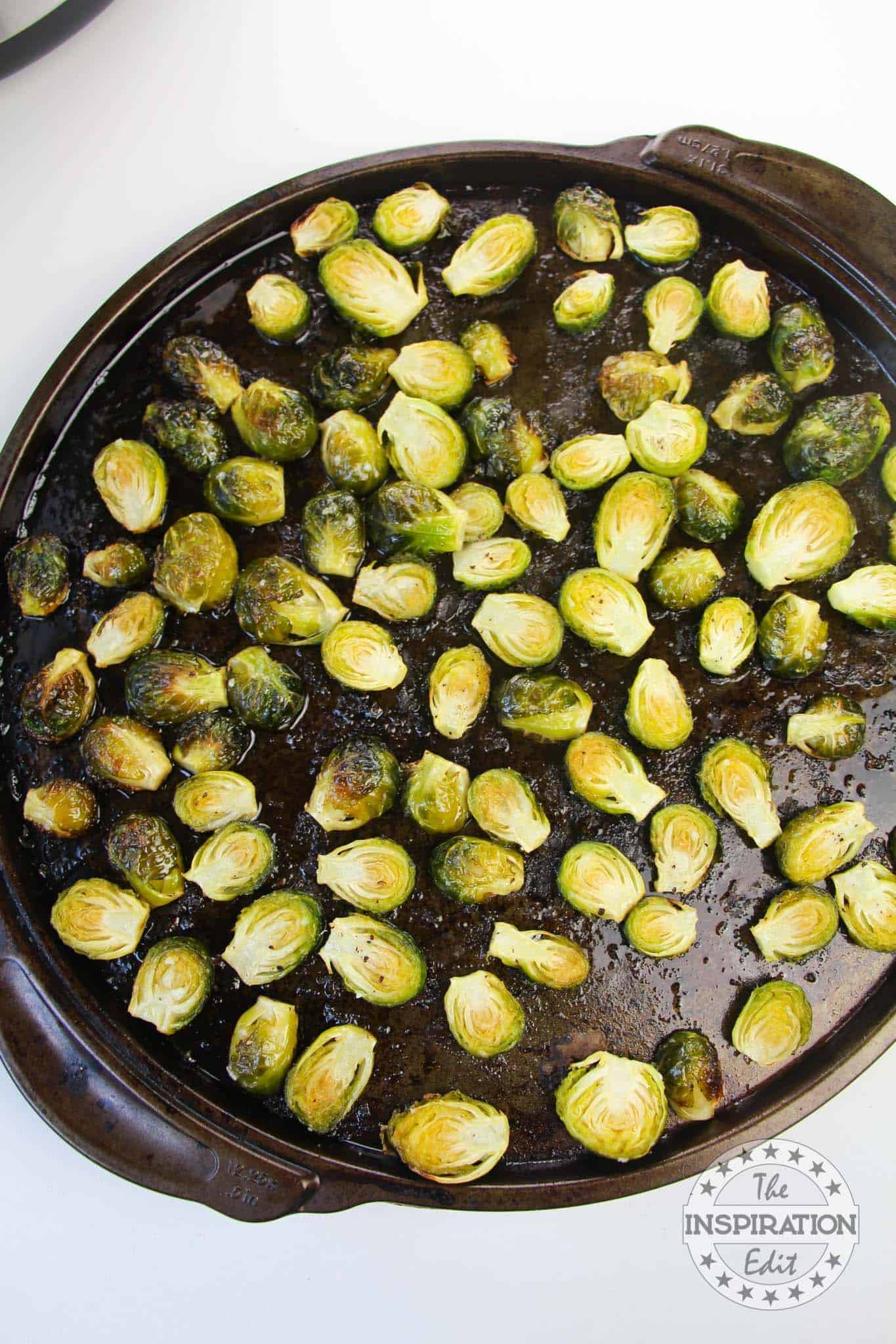 Roasted brussel sprouts in a pan.
