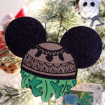 Maui Christmas ornament hanging on a tree.