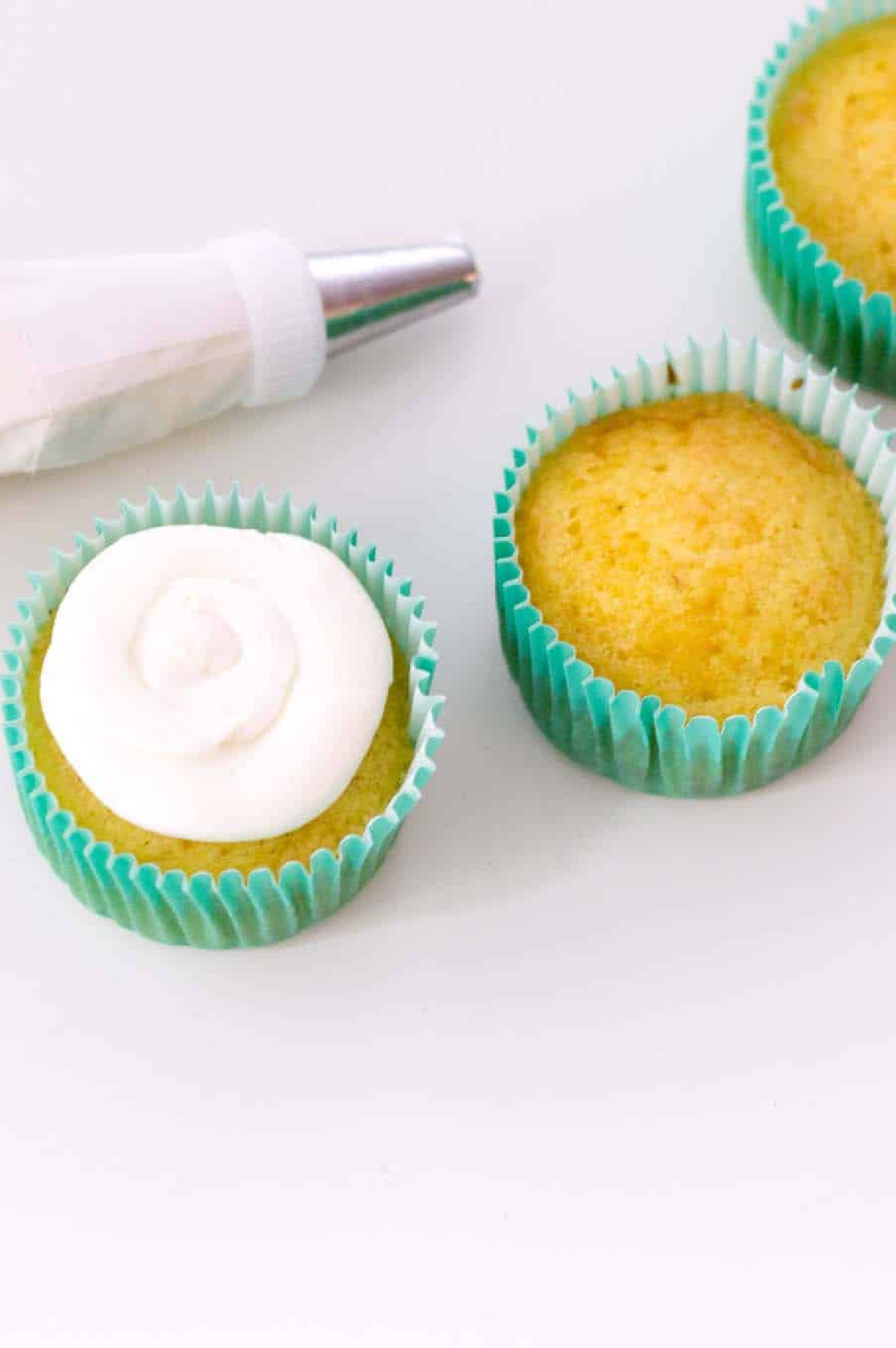 Decorating cupcakes with frosting.