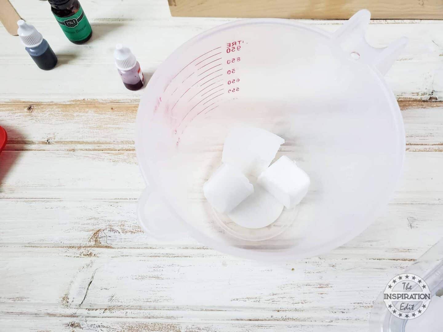 Microwave Safe Measuring Cup and Cubes of Goats Milk Soap.