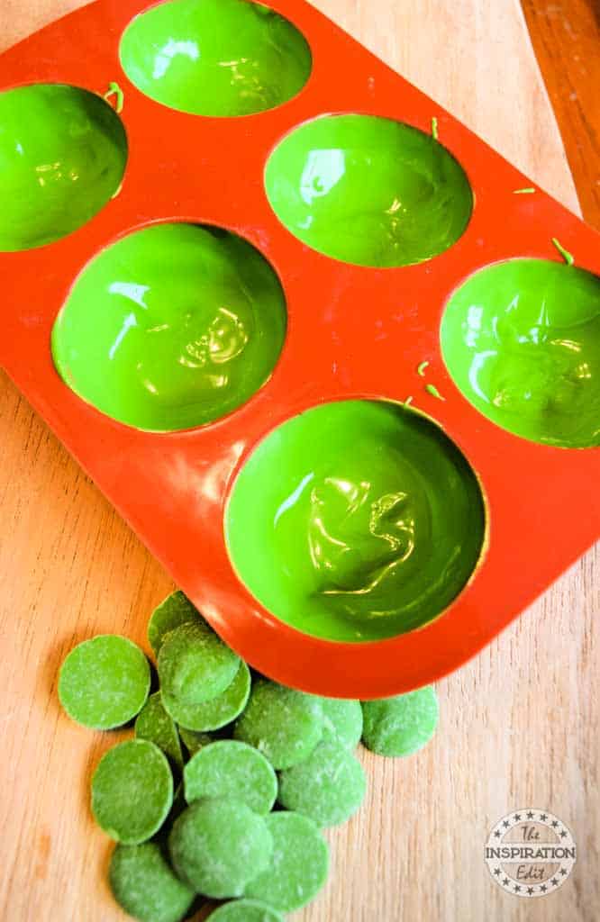 Silicone molds coated with melted green wafers.