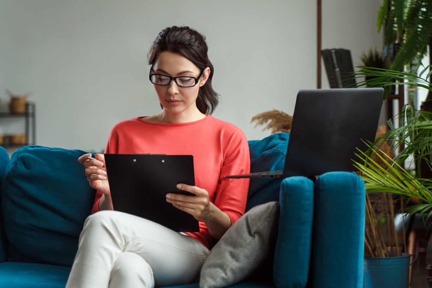 Run A Business From Home | Woman Looking At Her Business Emails On Her Device.