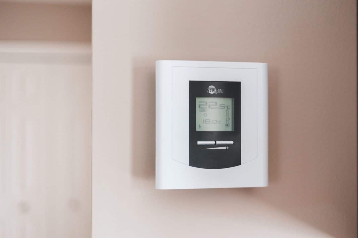 Lower AC Costs | A digital thermostat for the AC.