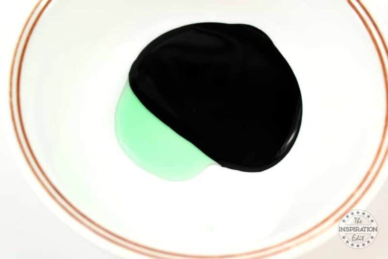 Adding the Dish Soap to the Black Paint.