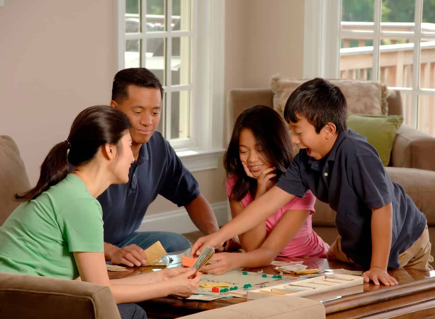 Parents Are Playing Monopoly With Their Children.