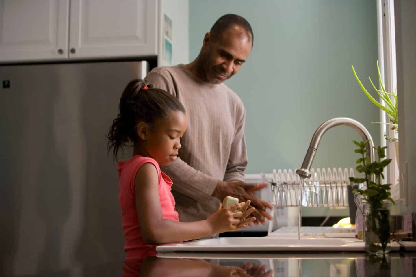 washing hands in sink.