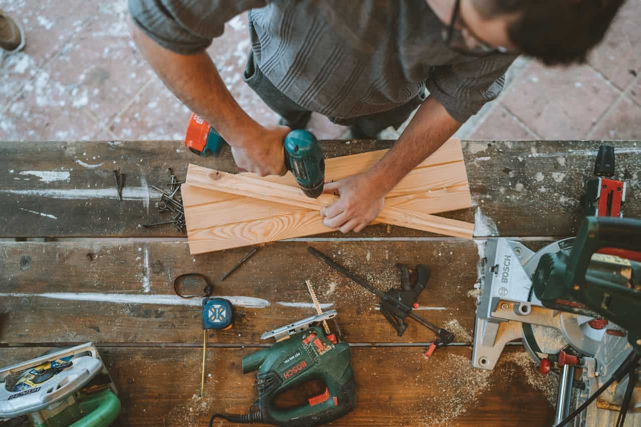 Handyman Working on Wooden Surface.