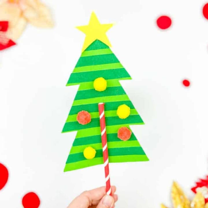 Christmas tree craft in a hand.