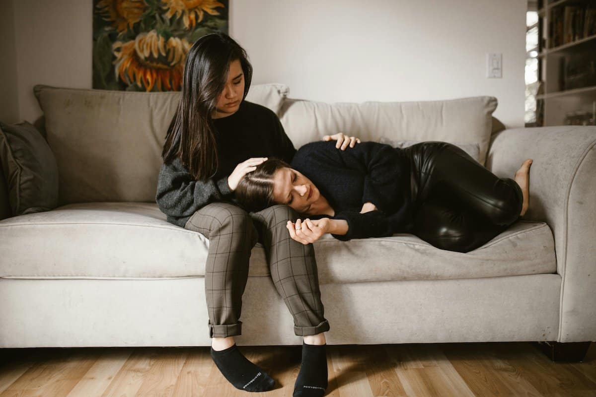 Family Law Support for Women | A Girl comforting her mom after a divorce.