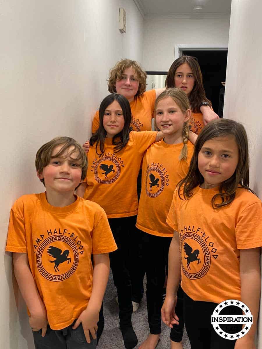 children wearing percy jackson camp half-blood t-shirts which have been made on a cricut machine and ironed with a cricut press.