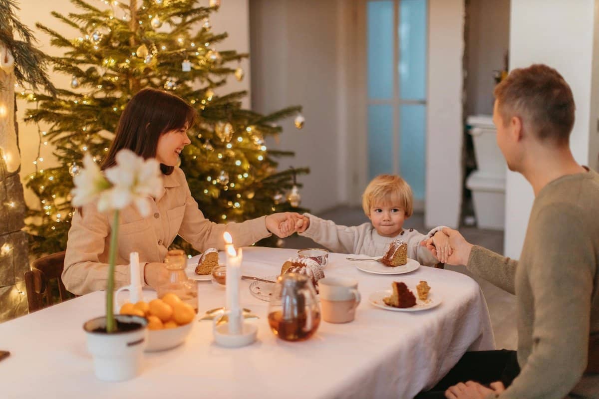 Navigating Holiday and Special Occasion | A Family sat at the table over Christmas.